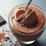 A bowl of rich and creamy quick keto chocolate mousse topped with dark chocolate shavings.