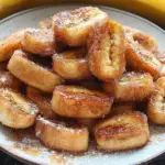 Pan Fried Cinnamon Bananas with Honey and Butter in a frying pan