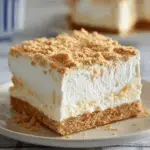 Sliced Woolworth's Icebox Cake showing creamy lemon layers and graham crackers